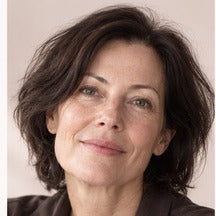 Woman using NAERVIA NAD+ firming serum