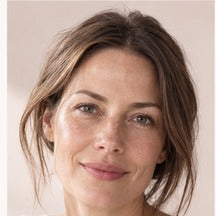 Woman using NAERVIA NAD+ firming serum