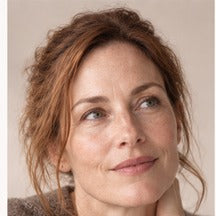 Woman using NAERVIA NAD+ firming serum