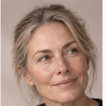 Woman using NAERVIA NAD+ firming serum