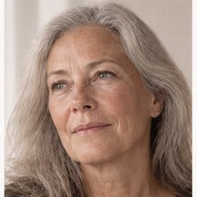 Woman using NAERVIA NAD+ firming serum